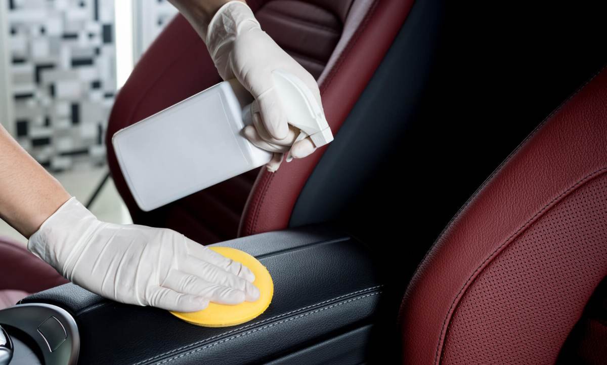 Woman applying best leather conditioner