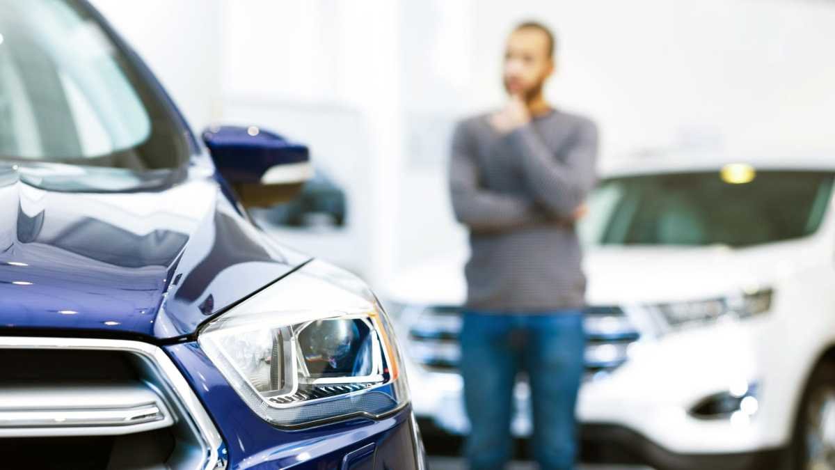 Man thinking about buying a Kia.